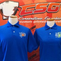 Couple of blue polo shirts with embroidered logo
